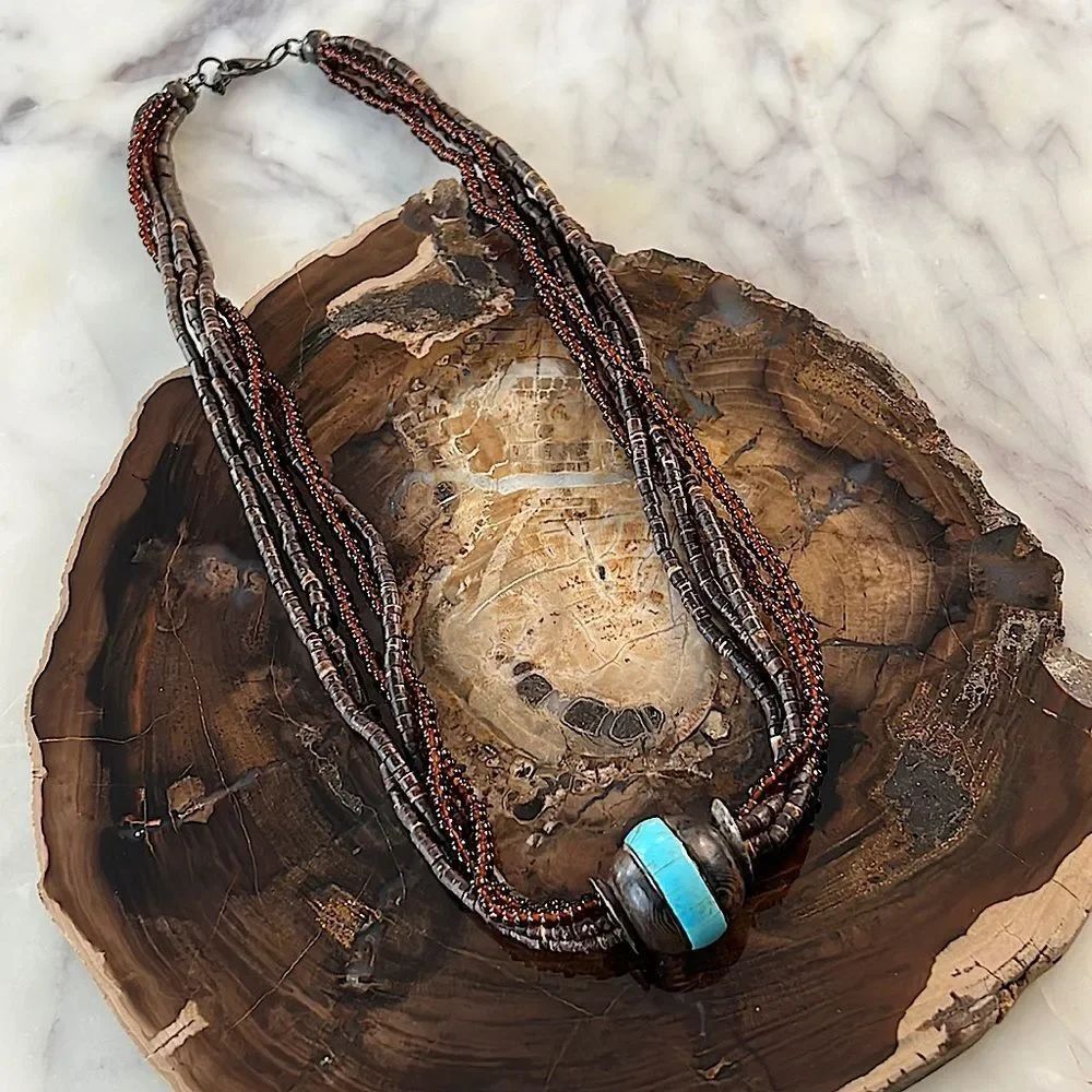 * Multi strand, brown wooden and beaded necklace with turquoise